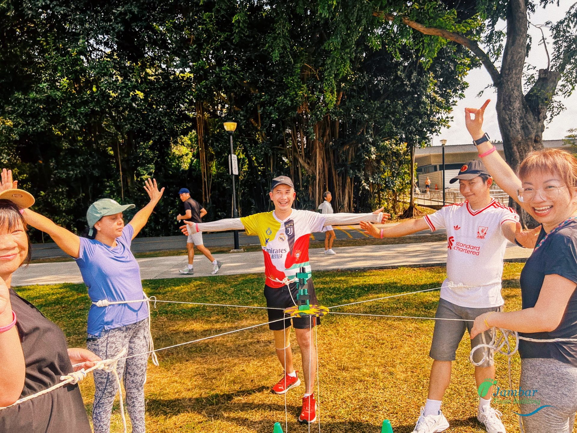 A group of people playing Outdoor Telematch Games team building activity in Singapore